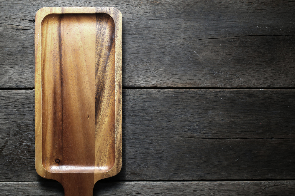 wood cutting board on wood background