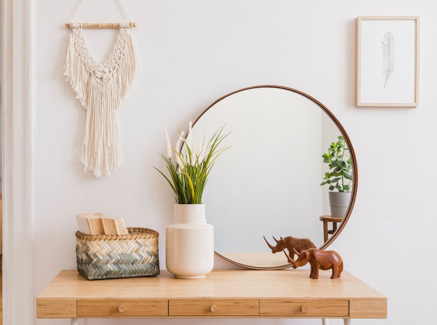 entry table with mirror and decorative accessories