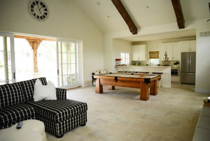 Veranda doors open to interior game room lounge
