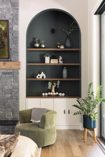 arched nooks with built in display shelves