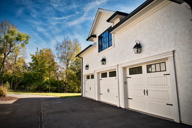Stucco carriage house garage design