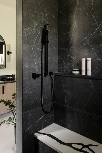contemporary shower design with black soapstone