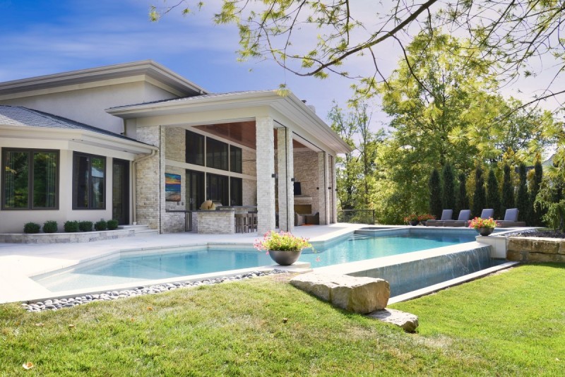 Covered patio and pool of modern home design