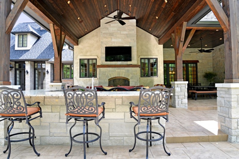 covered porch with outdoor fireplace design