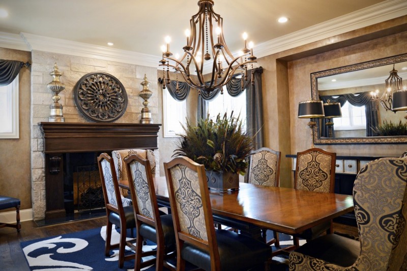 custom dinning room with stone fireplace