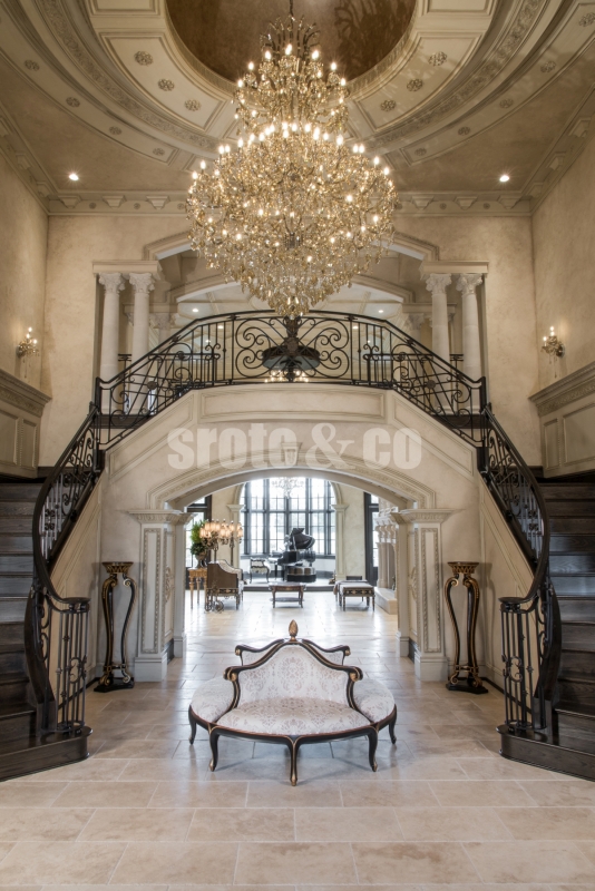 Foyer design with dual staircase