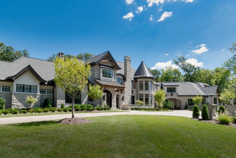 french country home design with porte cochere