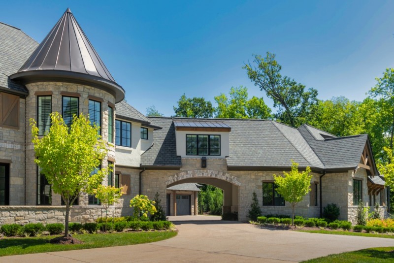 french country home turret with metal conical roof