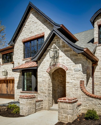 french country stone veneer with brick accents