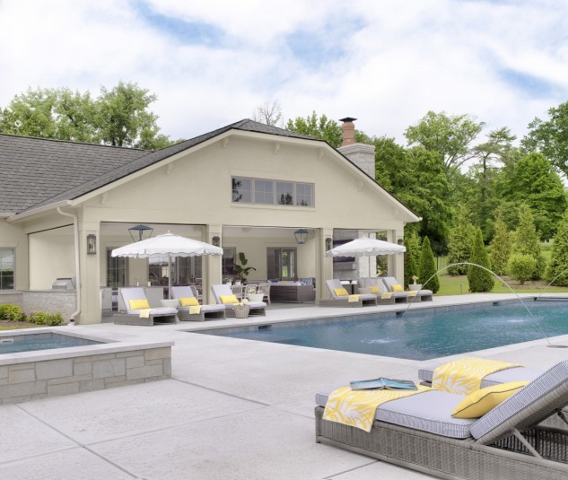 french pool house design with stucco exterior