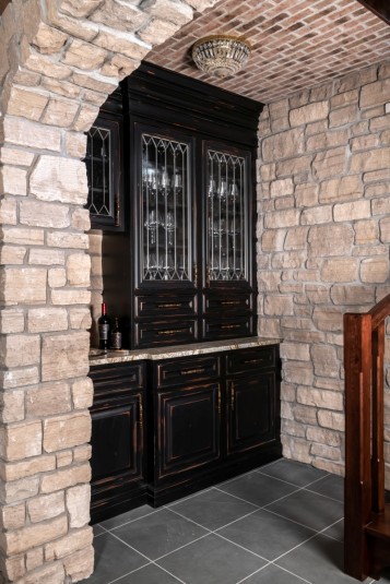 home wine cellar stone wall arch entry