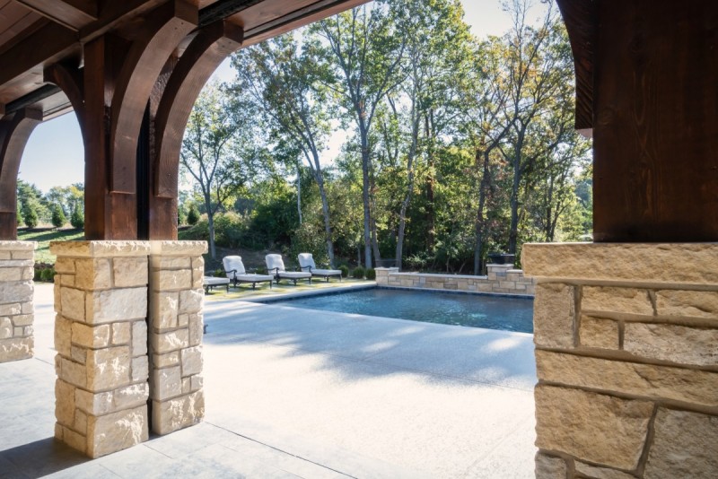 Patio stone base and wood posts with corbels design