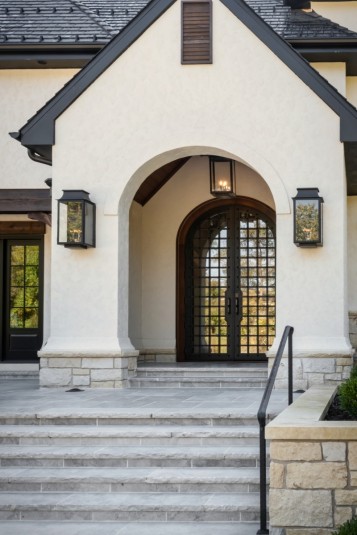 Front entry design of custom mediterranean stucco home