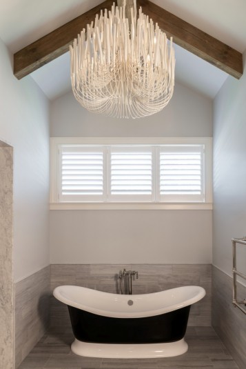master bath design with rustic beams