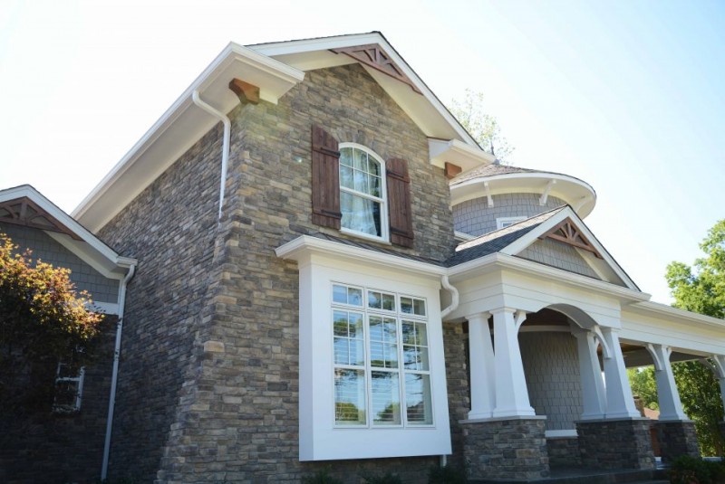 home design with shake siding and white painted timber