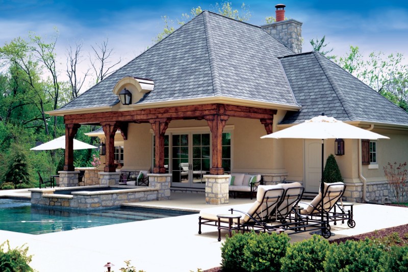 Residential pool house with covered patio designed by St Louis architects