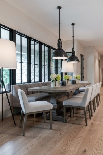 Farmhouse dining area with white oak flooring and custom lights