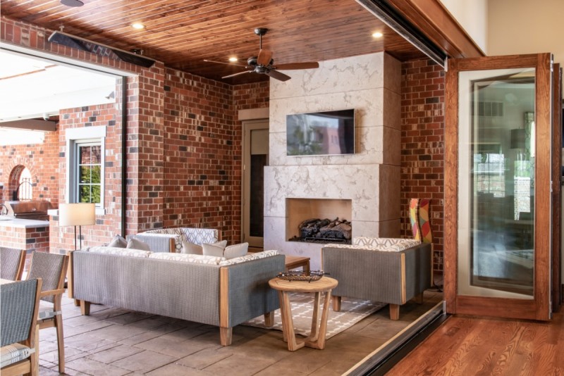 screened in porch with fireplace design